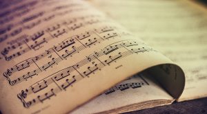  Music sheets on wooden background